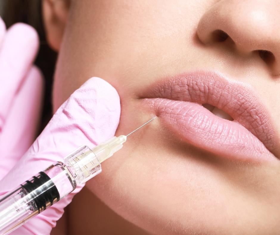 Close-up of an aesthetician injecting botox into a woman's forehead to smooth wrinkles